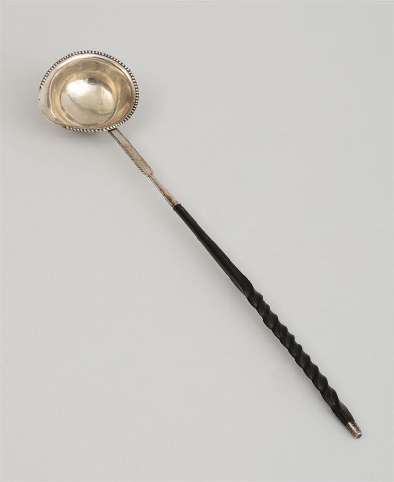 Appraisal: GEORGE III WOOD-HANDLED TODDY SPOON The ovoid bowl with rounded