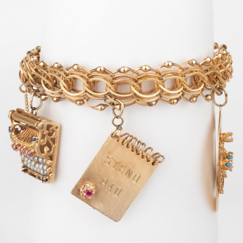 Appraisal: k Gold Charm Bracelet Marked ' k' in dwts Condition