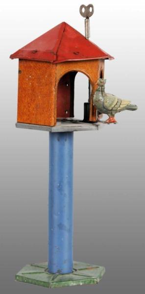 Appraisal: Tin Litho Pigeon Birdhouse Wind-Up Toy Description German Working When