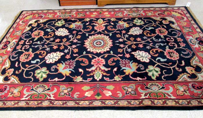 Appraisal: HAND KNOTTED ORIENTAL CARPET Pakistani-Persian overall stylized color floral design