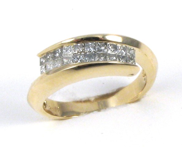 Appraisal: DIAMOND AND FOURTEEN KARAT GOLD RING set with princess-cut diamonds