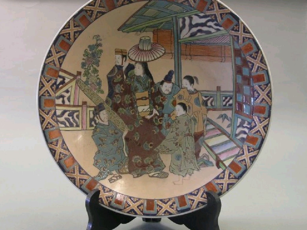 Appraisal: A large Oriental porcelain wall plate painted with a group