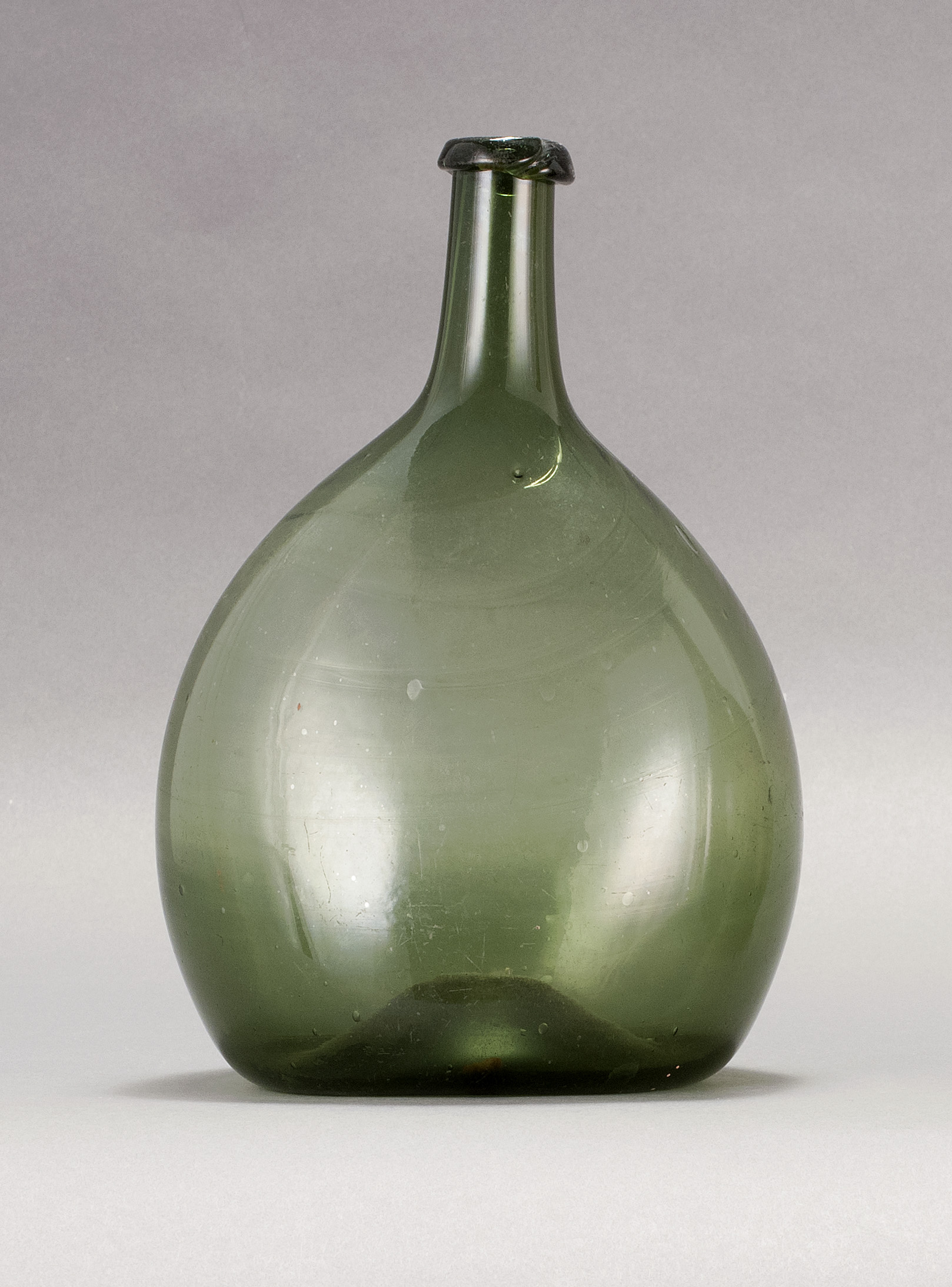 Appraisal: FREE-BLOWN GLASS CHESTNUT FLASK Early th CenturyIn medium green Height