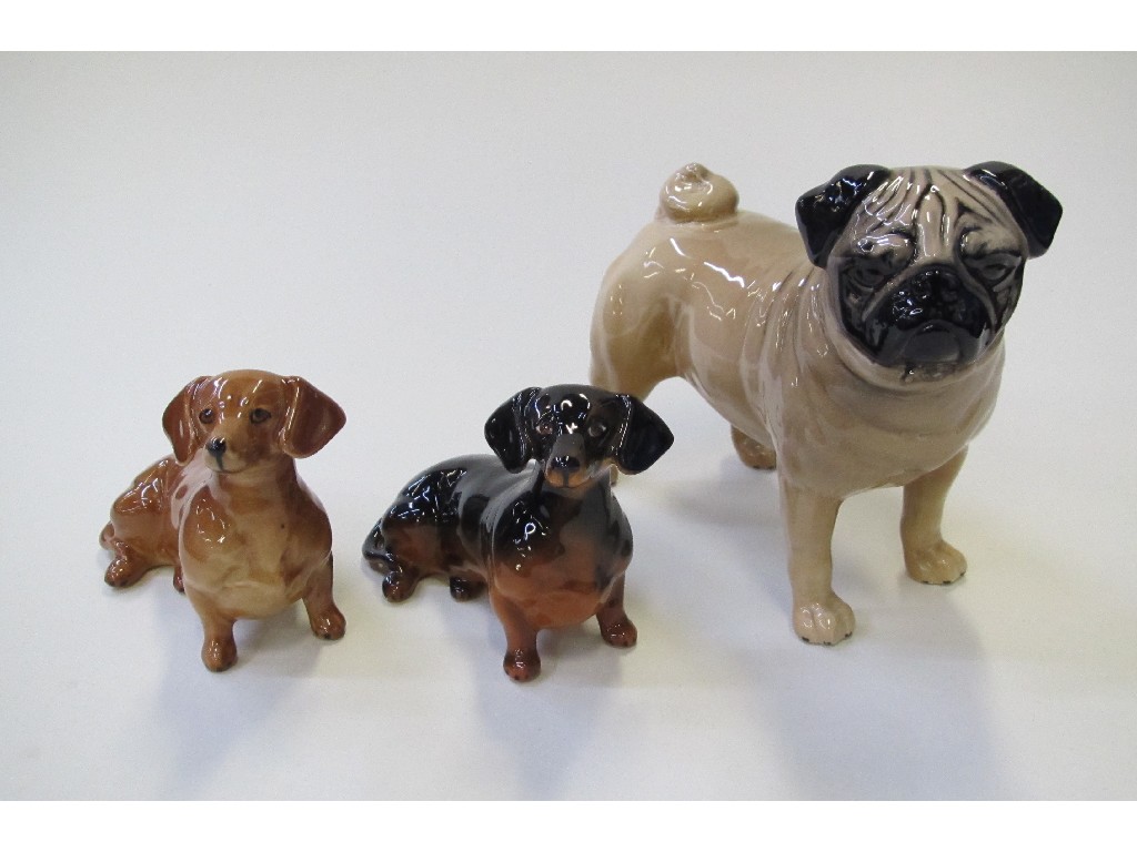 Appraisal: Three Beswick dogs including Pug Ch Cutmil Cupie and two