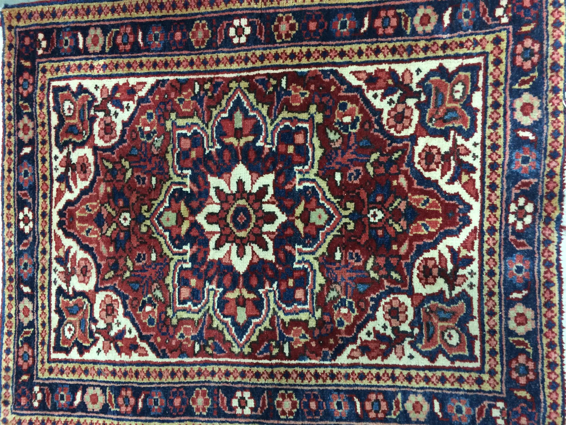 Appraisal: ORIENTAL MAT Iran mid th century Heriz mat with red