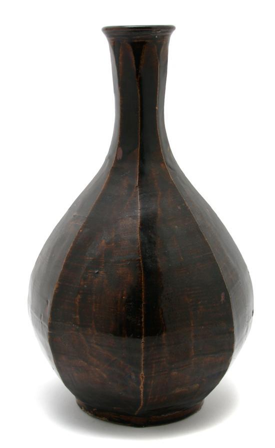 Appraisal: A Korean Ceramic Faceted Bottle Vase with brown glaze throughout