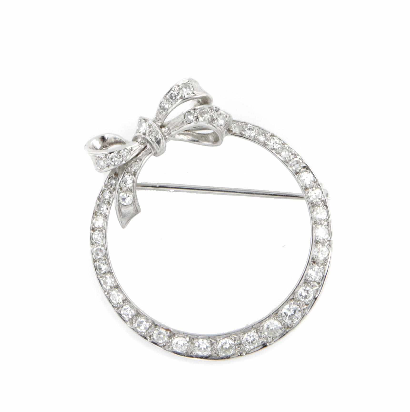 Appraisal: A diamond circle bow brooch mounted in white gold diameter