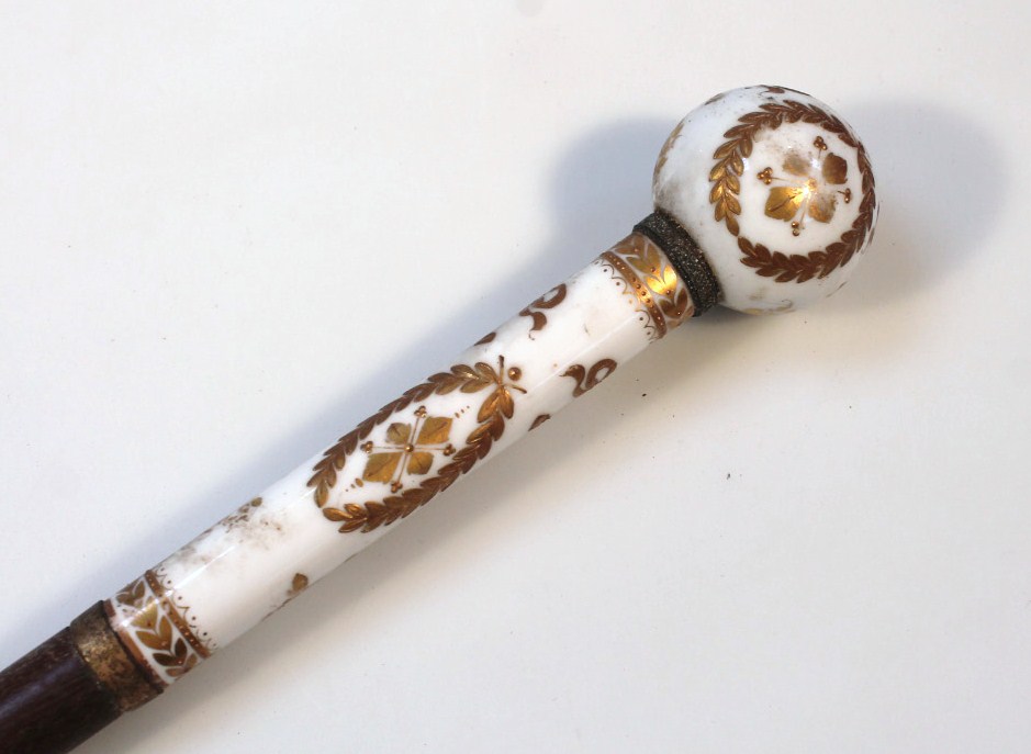 Appraisal: A rare thC porcelain walking stick handle with orb finial