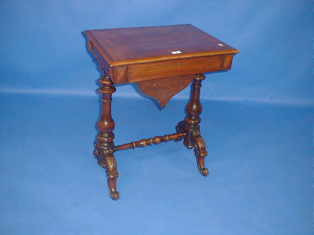 Appraisal: A Victorian walnut work table with cross banded and moulded