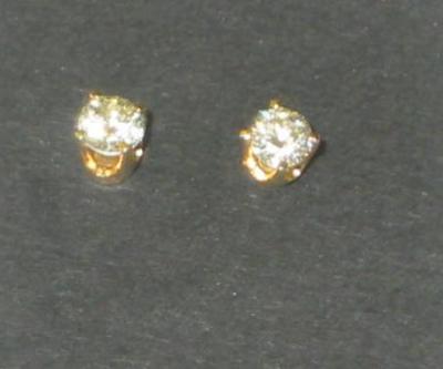 Appraisal: A PAIR OF DIAMOND EAR STUDS the brilliant cut stones