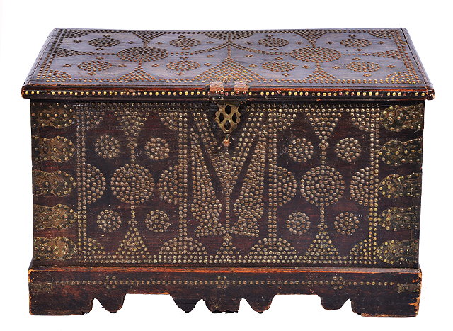 Appraisal: AN OLD HARDWOOD ZANZIBAR CHEST with brass studded decoration and