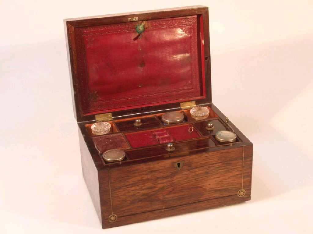 Appraisal: A thC rosewood ladies travelling case with brass inlay interior