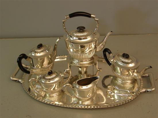 Appraisal: Foreign silver coloured metal tea service comprising a kettle on