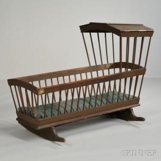 Appraisal: Brown-painted Windsor Cradle New England early th century the arched