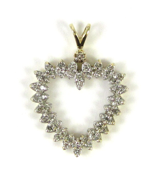 Appraisal: DIAMOND AND TEN KARAT GOLD HEART PENDANT the open heart