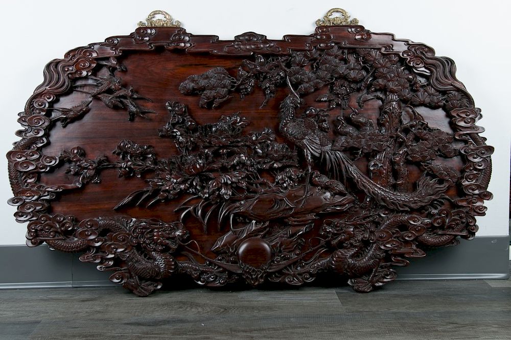 Appraisal: CARVED SUANZHI WOOD DRAGON PANEL A wood carved hanging panel