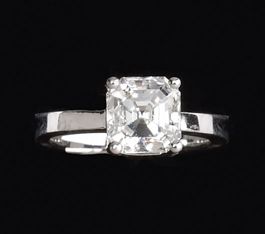 Appraisal: DIAMOND RING Platinum diamond ring set with one square emerald