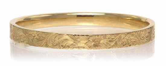 Appraisal: A Karat Yellow Gold Hinged Bangle with intricate foliate motif