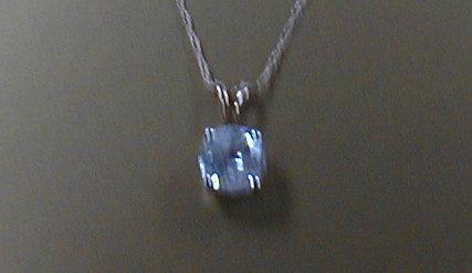 Appraisal: A diamond solitaire pendant claw set mounted estimated diamond weight