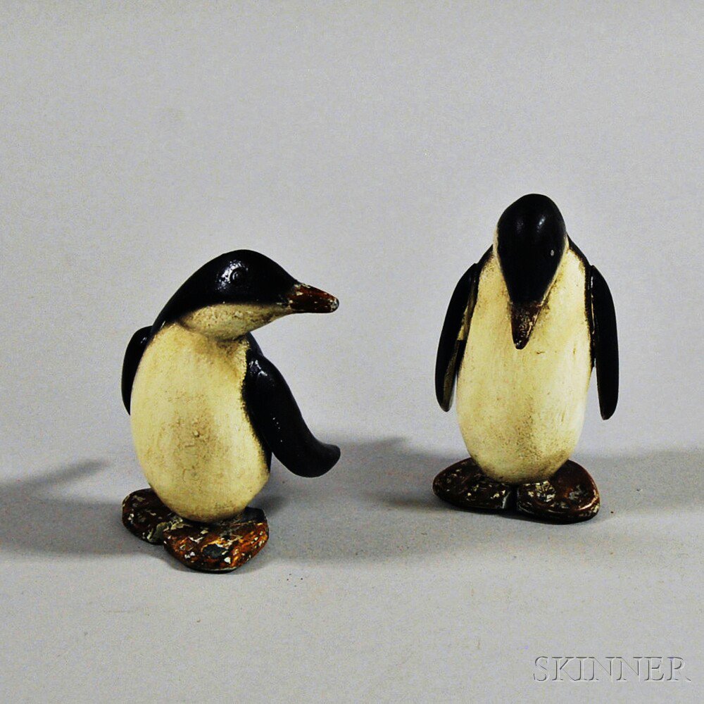 Appraisal: Pair of Carved and Painted Walnut Penguins th century ht