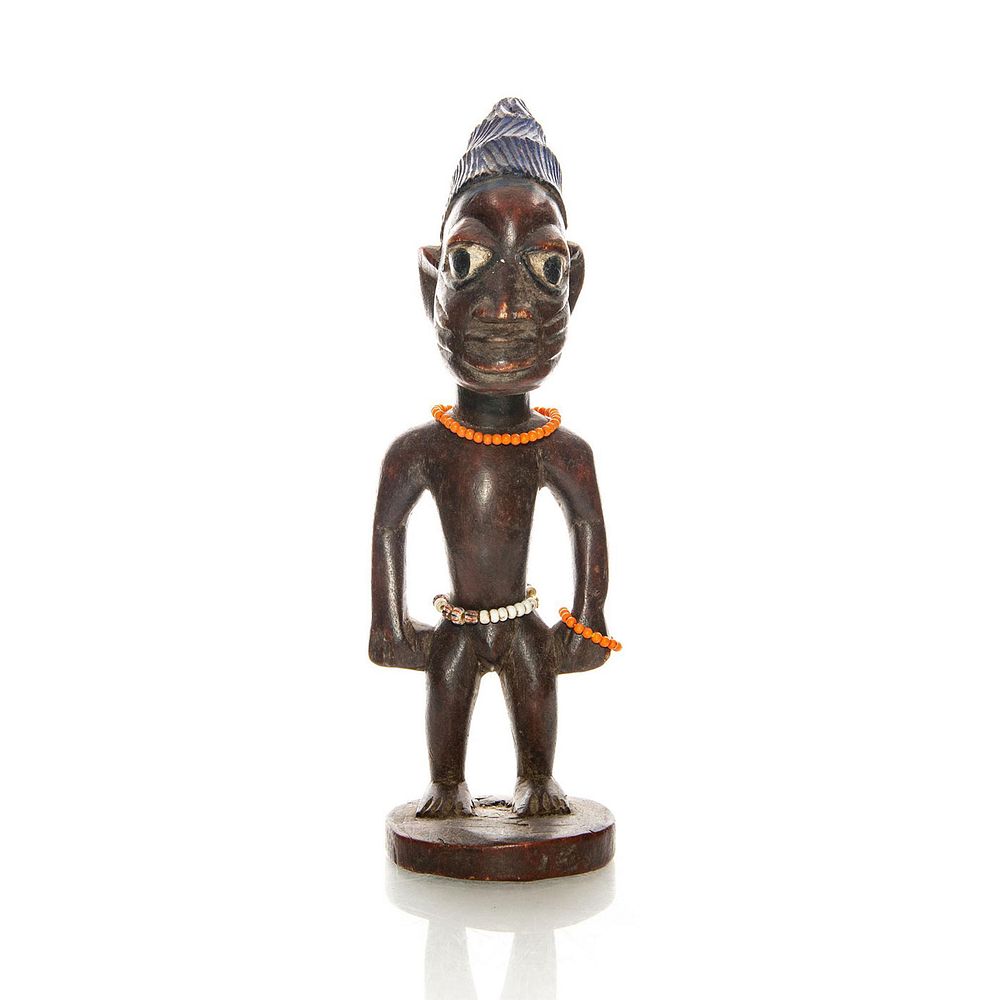 Appraisal: NIGERIAN WOOD SCULPTURE OF MAN WITH BEADS Hand carved with