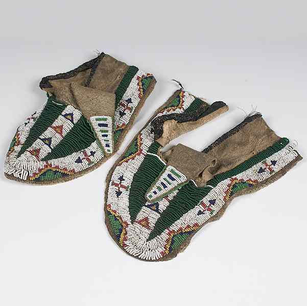 Appraisal: Sioux Beaded Hide Buffalo Hide Moccasins thread and sinew-sewn and