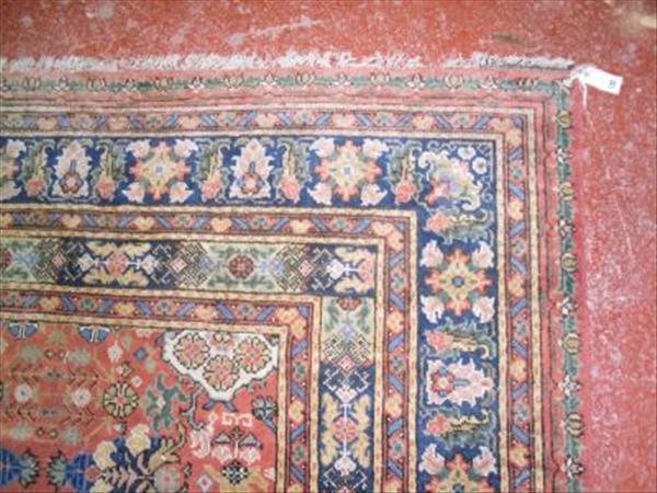 Appraisal: A Mahal carpet the salmon field with allover decoration moth