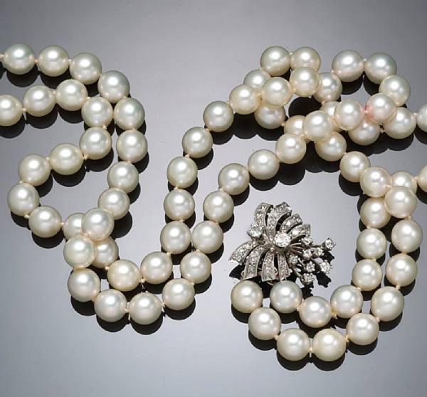 Appraisal: A cultured pearl and diamond double strand necklace cultured pearls