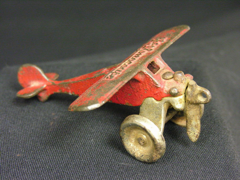 Appraisal: ARCADE THE MONOCOUPE CAST IRON AIRPLANE Estate item Size Condition