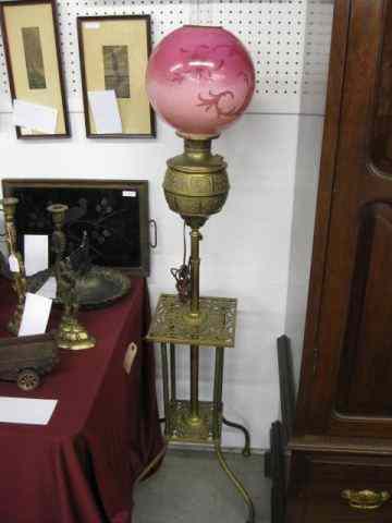 Appraisal: Victorian Piano Lamp ornate brass base telescopic handpainted burgundy globe