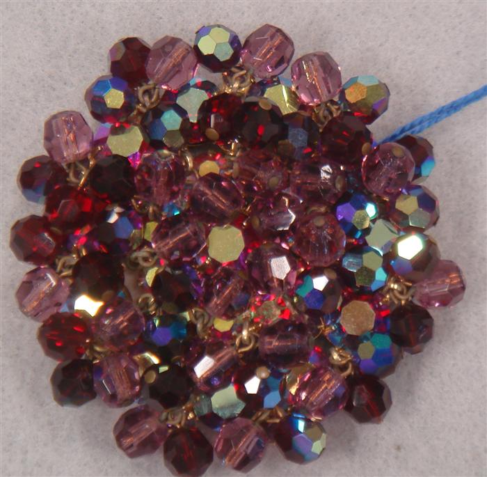 Appraisal: Ruby red iridescent stone brooch Estimate -