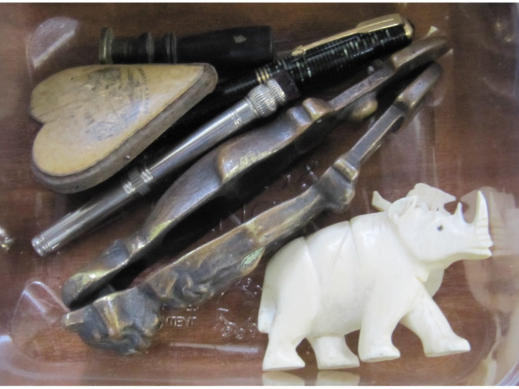 Appraisal: Lot comprising nut crackers rhino figures pin cushions etc