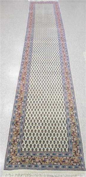 Appraisal: HAND KNOTTED ORIENTAL RUNNER Indo-Persian Persian Senneh design of repeating