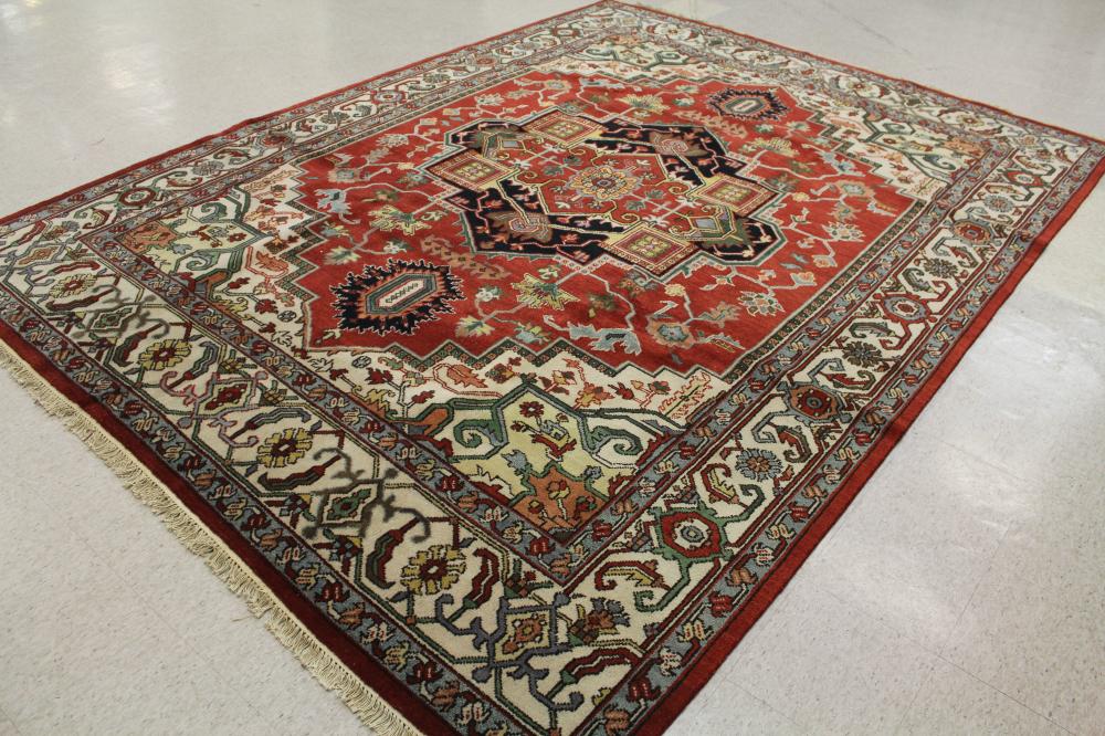 Appraisal: HAND KNOTTED ORIENTAL CARPET Persian Serapi or Heriz design centering