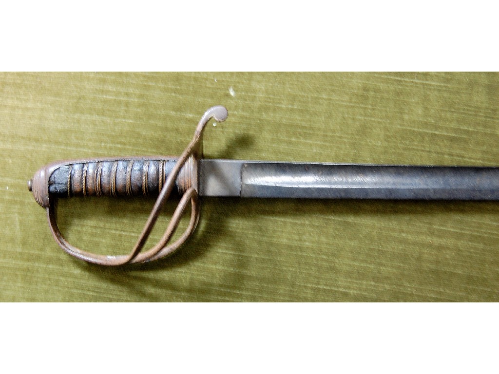 Appraisal: A Georgian military sword with cm slightly curved blade steel