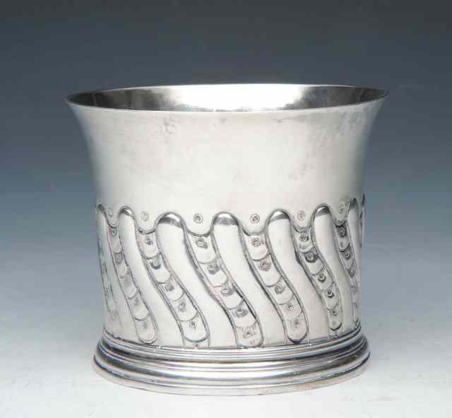 Appraisal: A PROVINCIAL BEAKER chased with wrythen decoration and with a