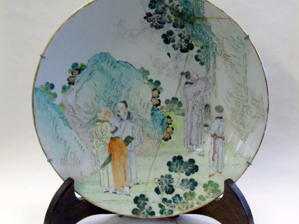 Appraisal: Oriental wall plate decorated with a man painting in a