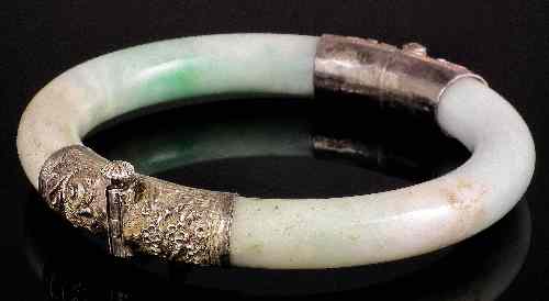 Appraisal: A Chinese jade and white metal mounted bangle ins mm