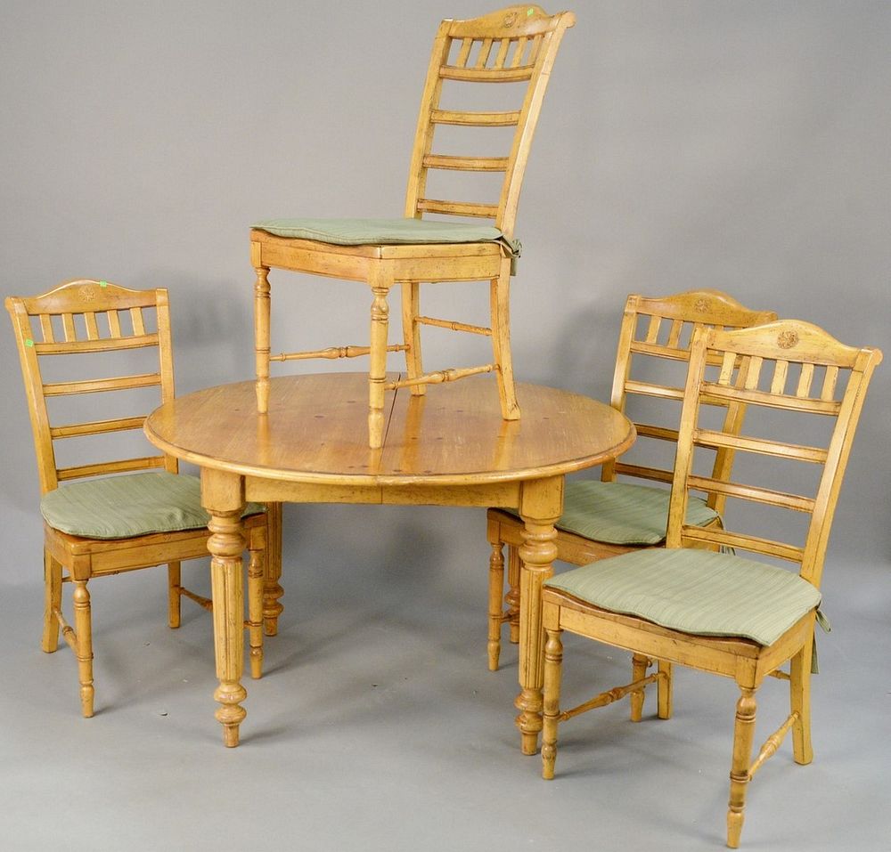 Appraisal: Five piece dining set with round pine table leaf dia