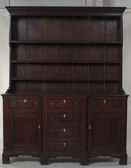 Appraisal: An th century provincial oak kitchen dresser the projecting cornice