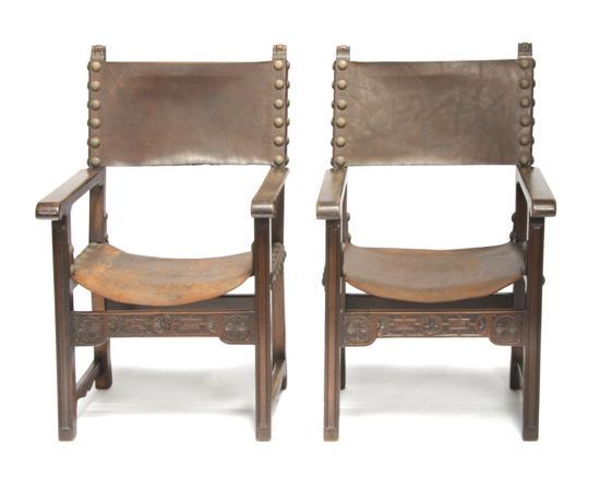 Appraisal: Pair of Renaissance Revival Armchairs having a leather back and