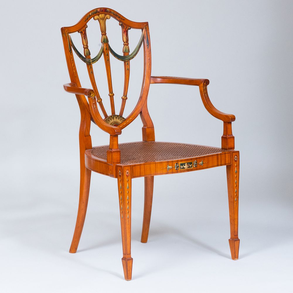 Appraisal: Edwardian Painted Satinwood Shield Back Armchair Fitted with a caned