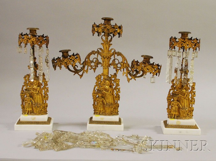 Appraisal: Three-Piece Gilt-metal Mother and Daughter Figural Marble-base Girandole Set with