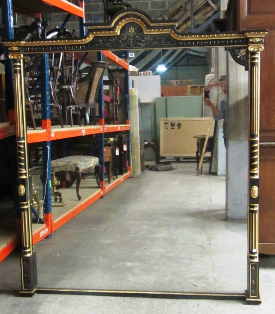 Appraisal: A Victorian parcel gilt ebonised overmantel wall mirror with bonnet