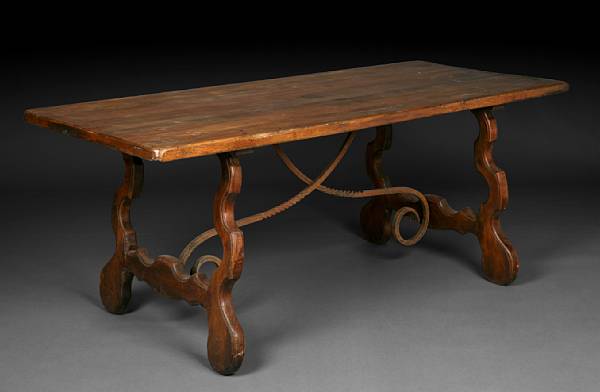 Appraisal: A Spanish Baroque style oak trestle table The rectangular top