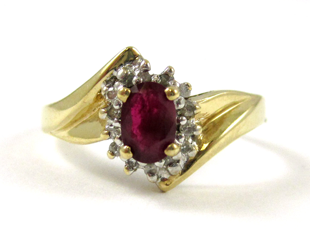 Appraisal: RUBY DIAMOND AND TEN KARAT GOLD RING set with round-cut