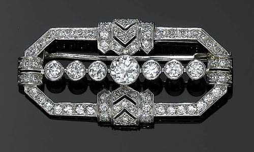 Appraisal: DIAMOND BROOCH ca Platinum Elegant brooch the centre set with