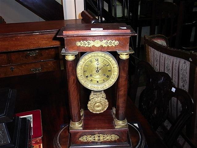 Appraisal: A FRENCH EMPIRE STYLE MAHOGANY AND FORMERLY PORTICO CLOCK with