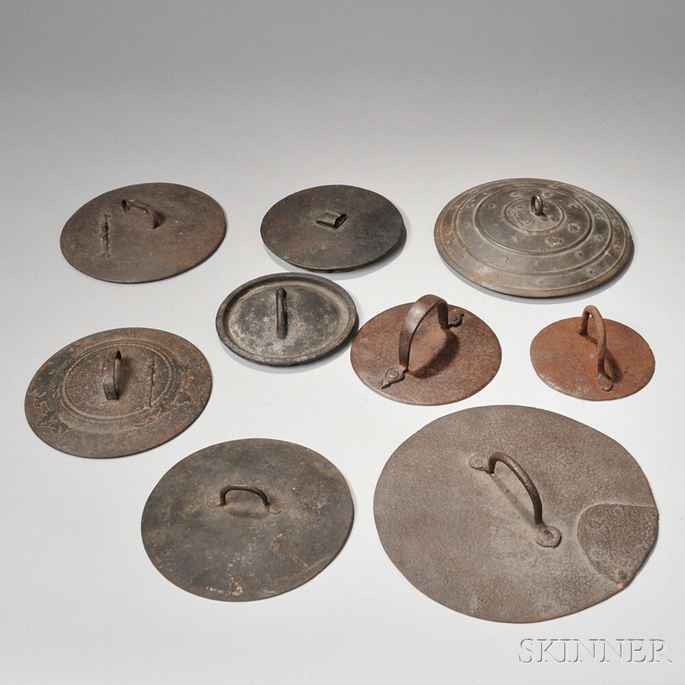 Appraisal: Nine Iron Pot Covers America late th early th century