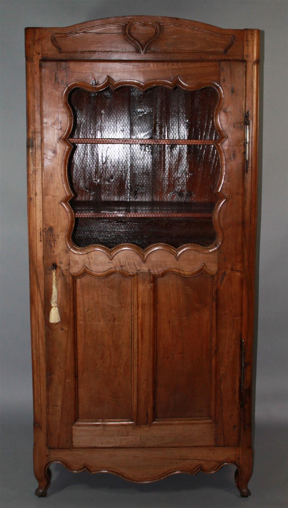 Appraisal: TALL LOUIS XV STYLE CARVED WALNUT CUPBOARD having a molded